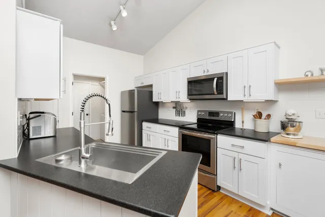 a bedroom with a bed and a cabinets