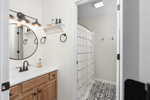 a bedroom with a bed and a table