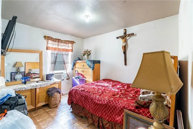 a bed room with a bed and a window