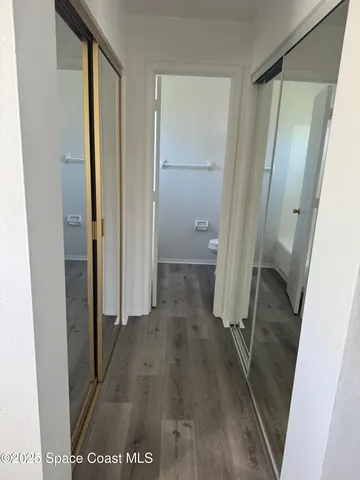 a view of a bathroom from a hallway
