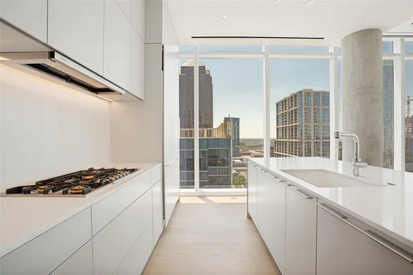 a kitchen with a sink and a refrigerator
