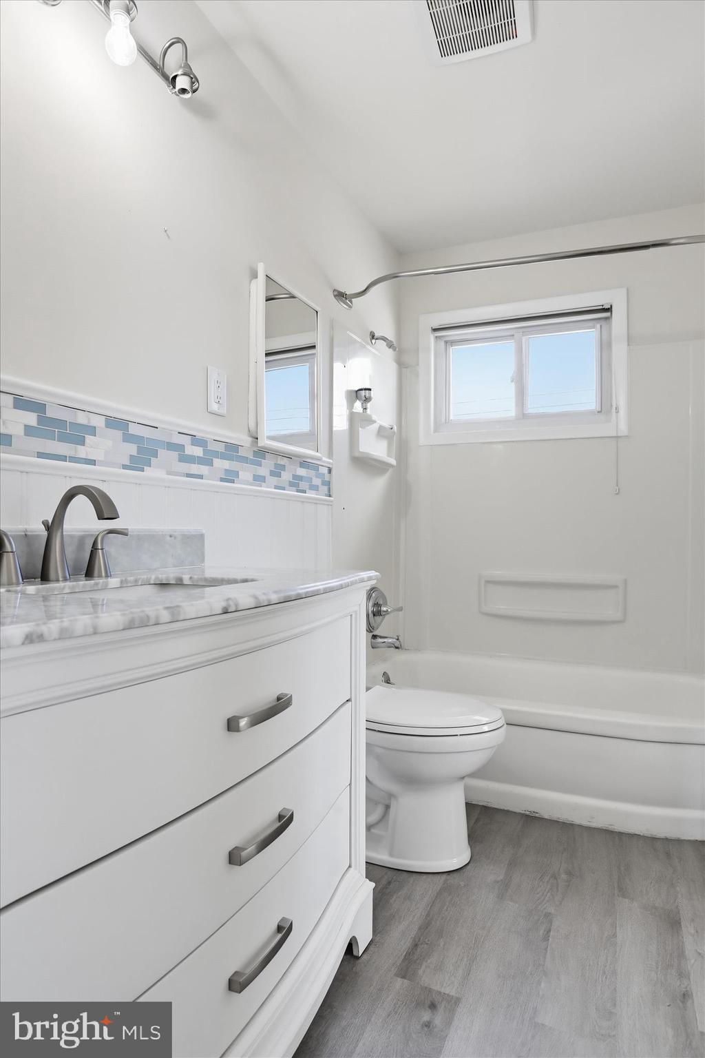 19022 Longmeadow Road Hagerstown, MD 21742 - Photo 12 of 30 a bathroom with a toilet sink and mirror