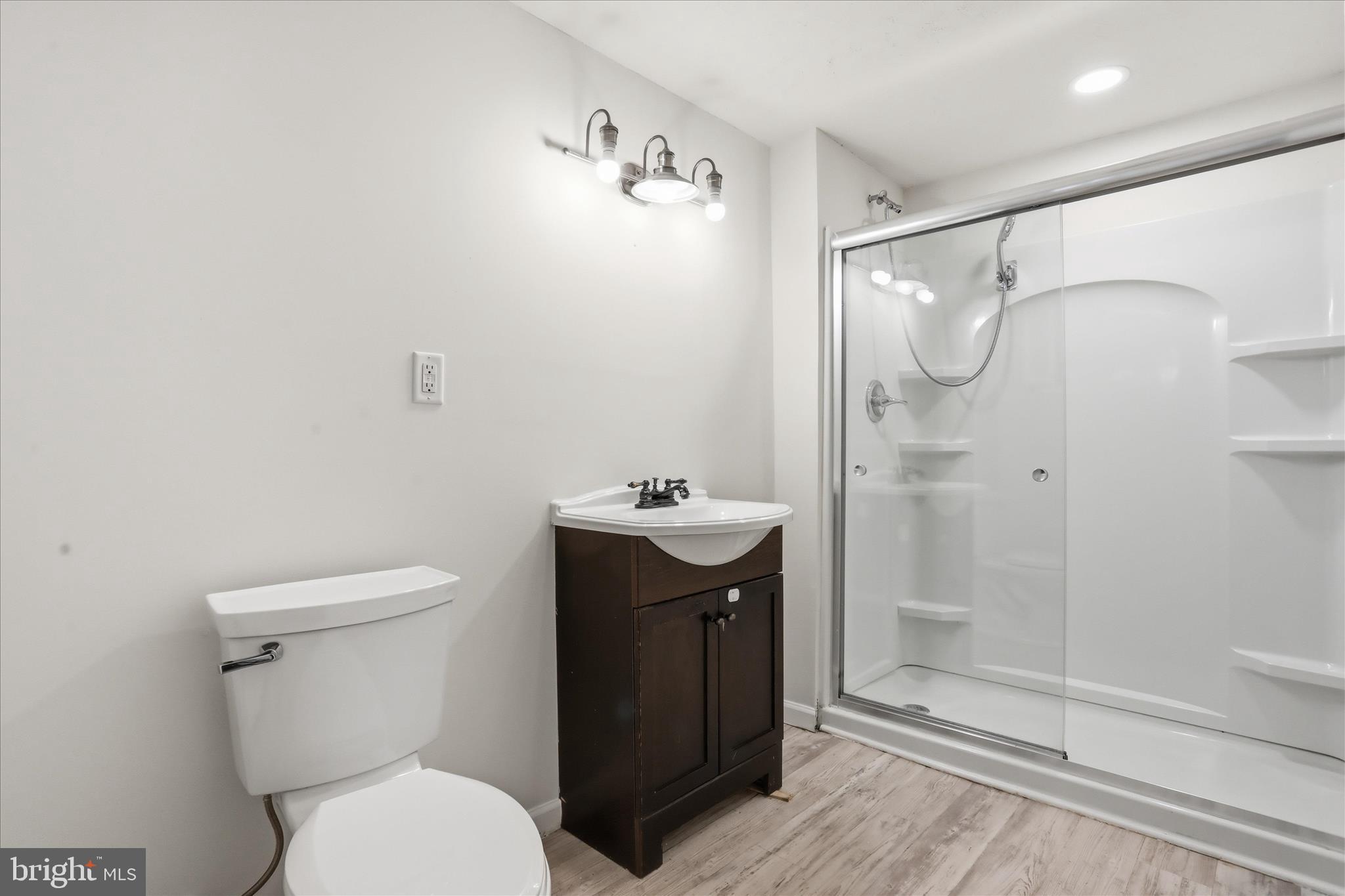 19022 Longmeadow Road Hagerstown, MD 21742 - Photo 14 of 30 a bathroom with a sink toilet and shower