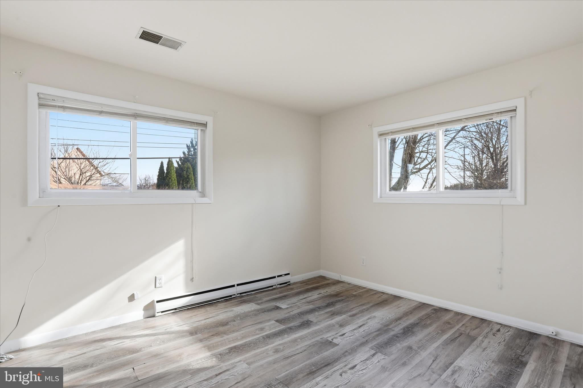 19022 Longmeadow Road Hagerstown, MD 21742 - Photo 15 of 30 a view of empty room with wooden floor and fan
