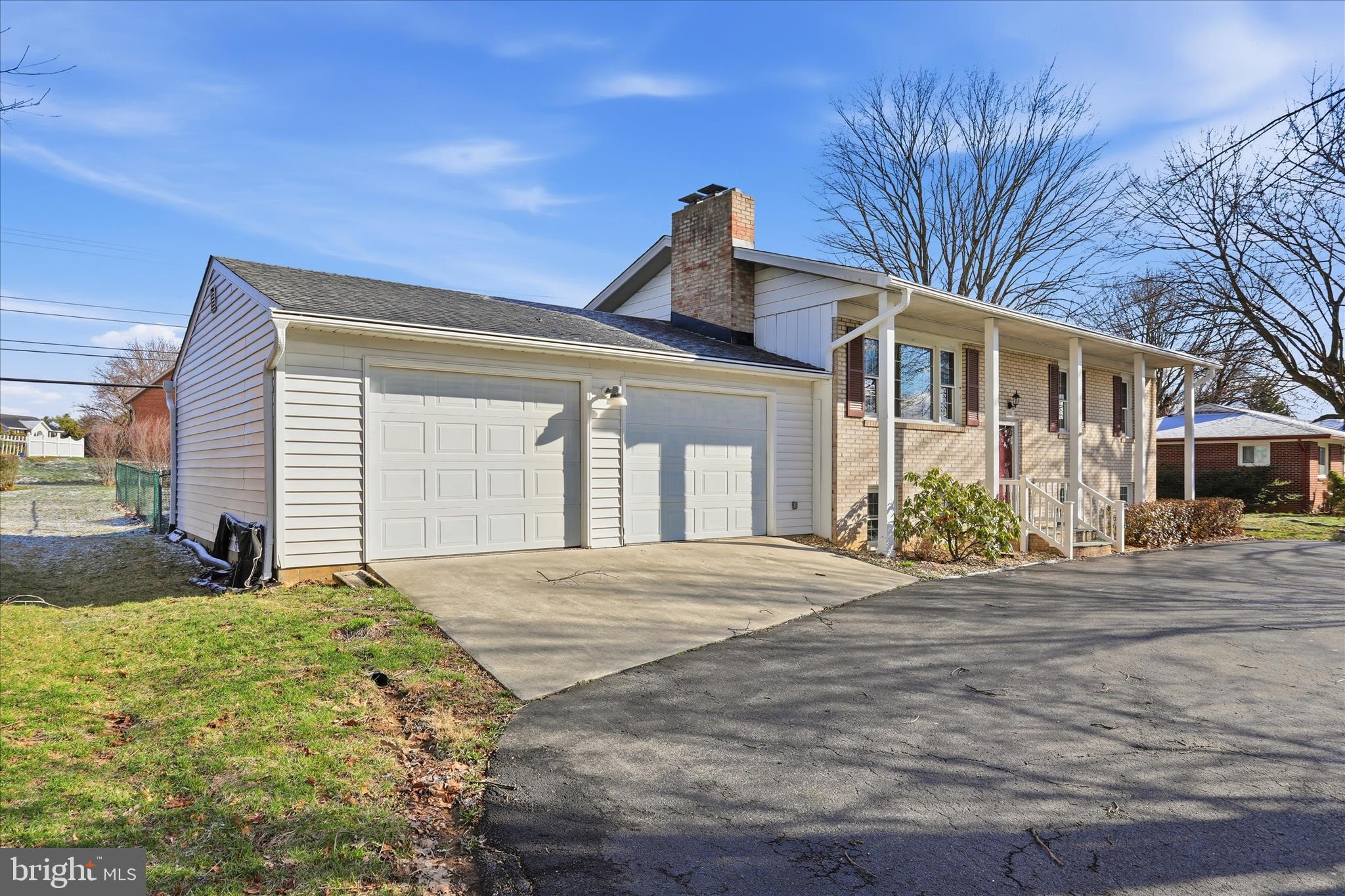 19022 Longmeadow Road Hagerstown, MD 21742 - Photo 2 of 30 a front view of a house with a garden