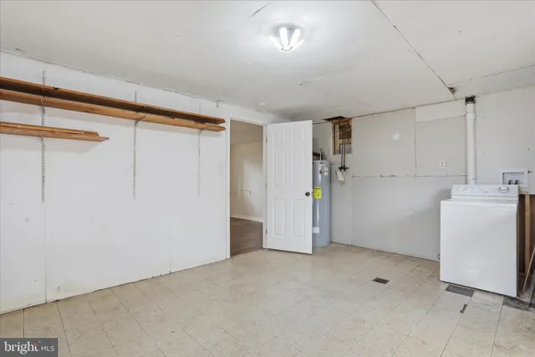 a view of a storage & utility room with a sink