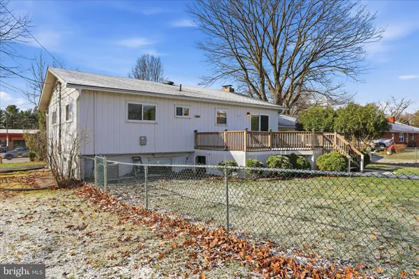 a house that has a tree in front of it