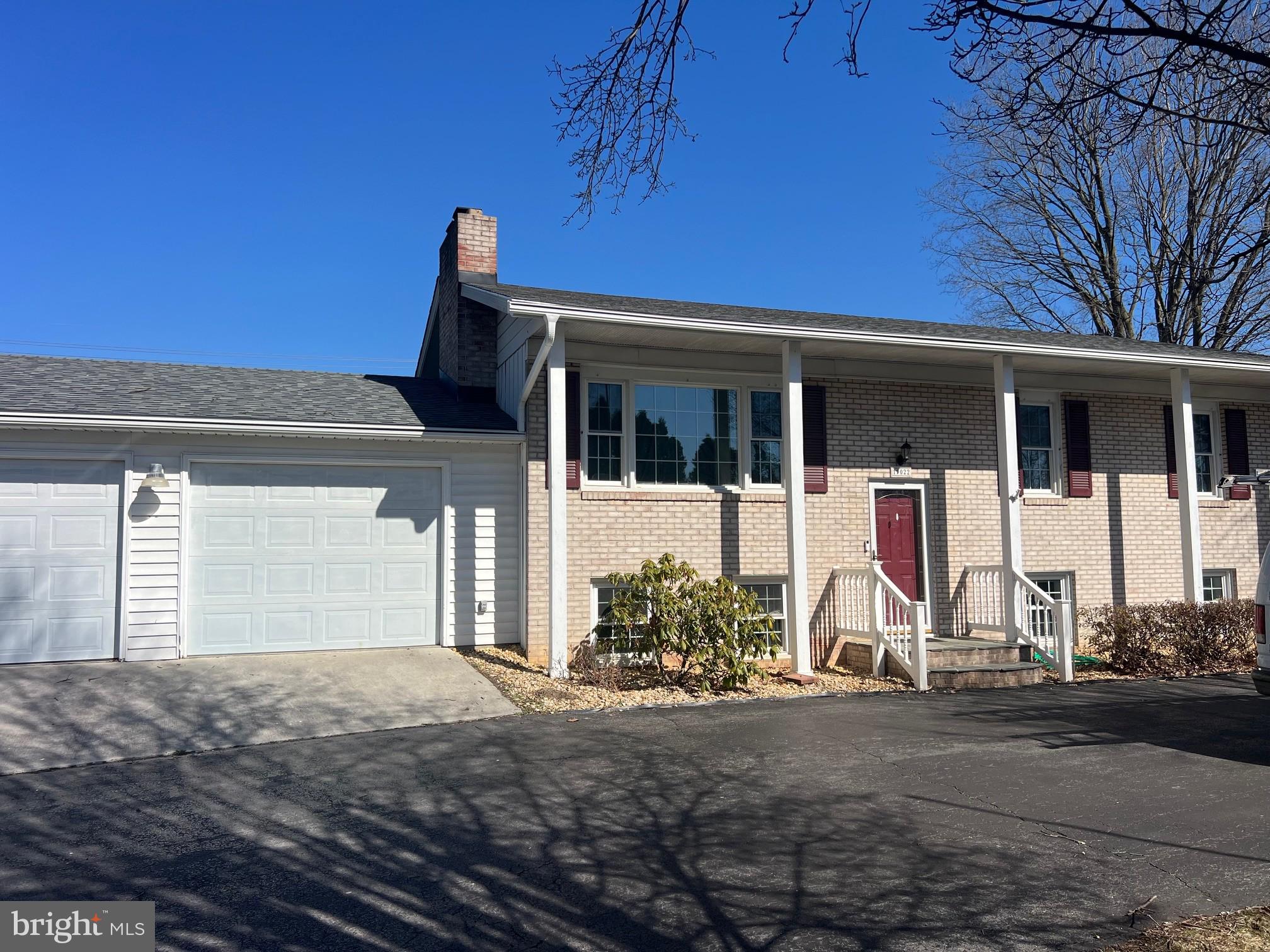 19022 Longmeadow Road Hagerstown, MD 21742 - Photo 26 of 30 a front view of a house with basket ball court