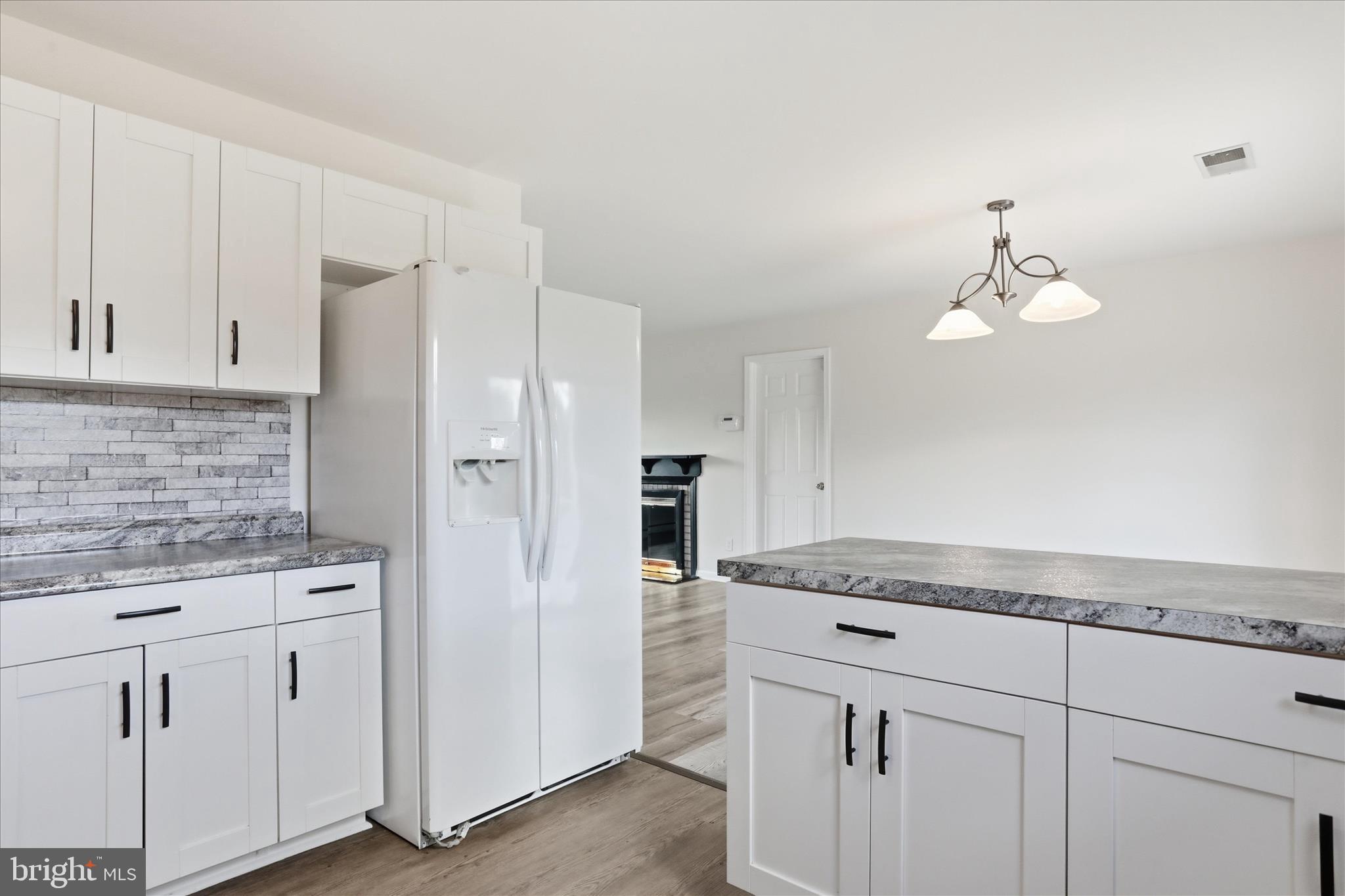 19022 Longmeadow Road Hagerstown, MD 21742 - Photo 5 of 30 a kitchen with white cabinets and refrigerator