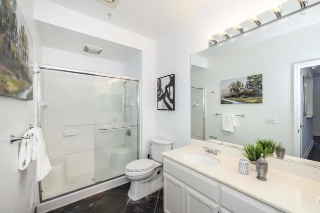 a bathroom with a double vanity sink and mirror