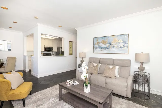 a living room with furniture and white walls