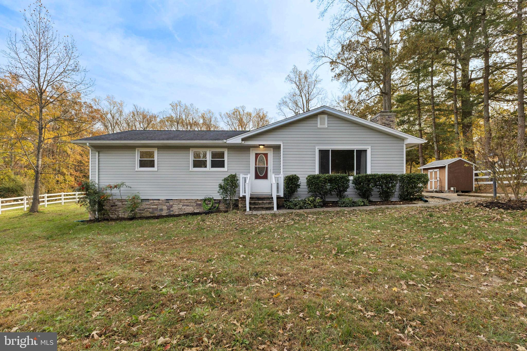 24530 Hollywood Road Hollywood, MD 20636 - Photo 1 of 40 a house view with a garden space