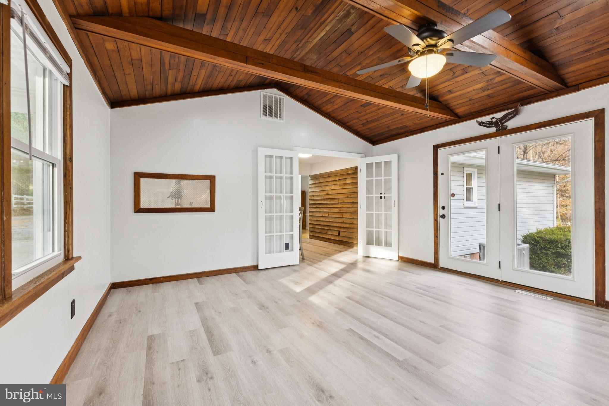 24530 Hollywood Road Hollywood, MD 20636 - Photo 17 of 40 a view of an empty room with wooden floor and a window