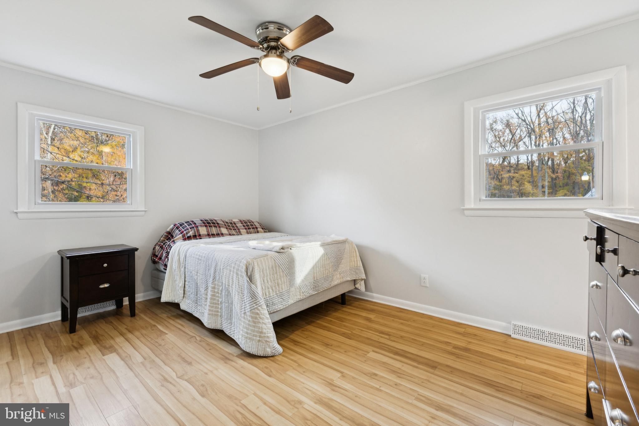 24530 Hollywood Road Hollywood, MD 20636 - Photo 19 of 40 a bedroom with a bed chandelier and a window