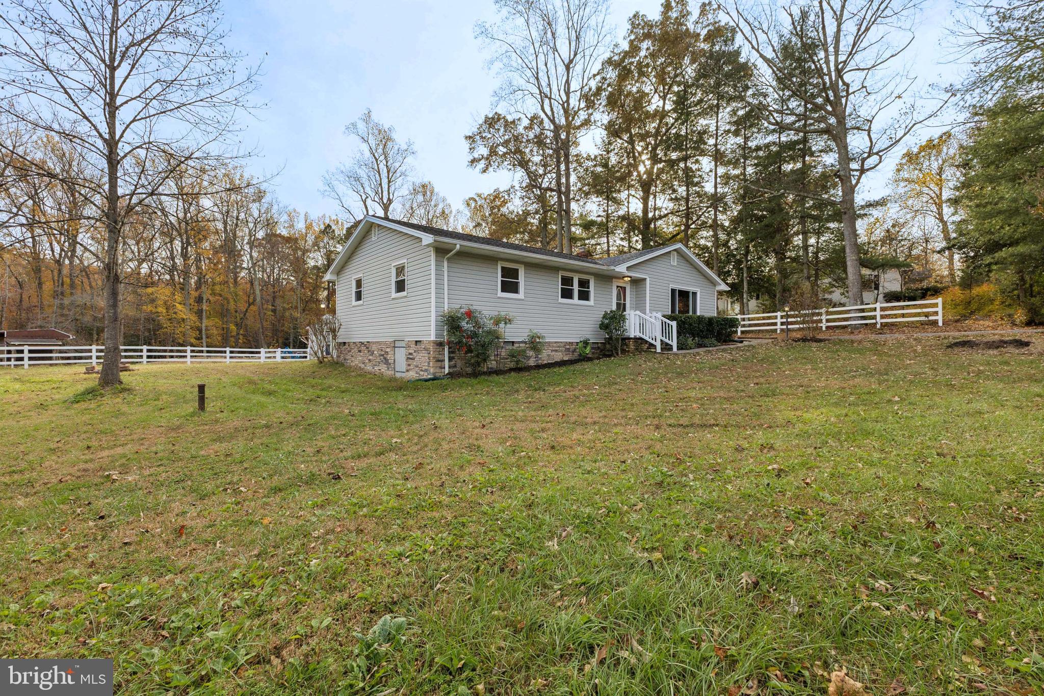 24530 Hollywood Road Hollywood, MD 20636 - Photo 2 of 40 a view of a house with a big yard and large trees