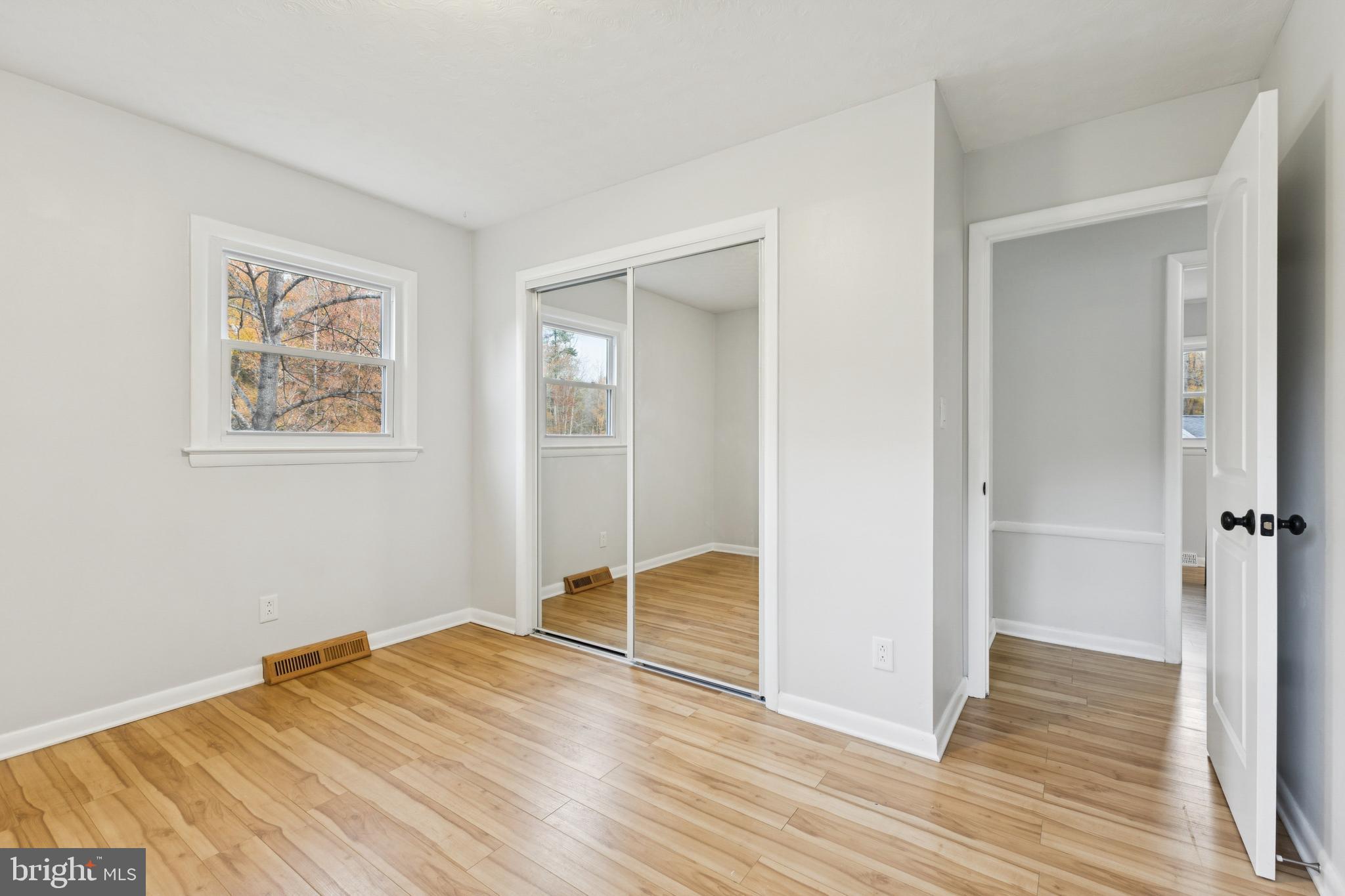 24530 Hollywood Road Hollywood, MD 20636 - Photo 24 of 40 a view of empty room with wooden floor