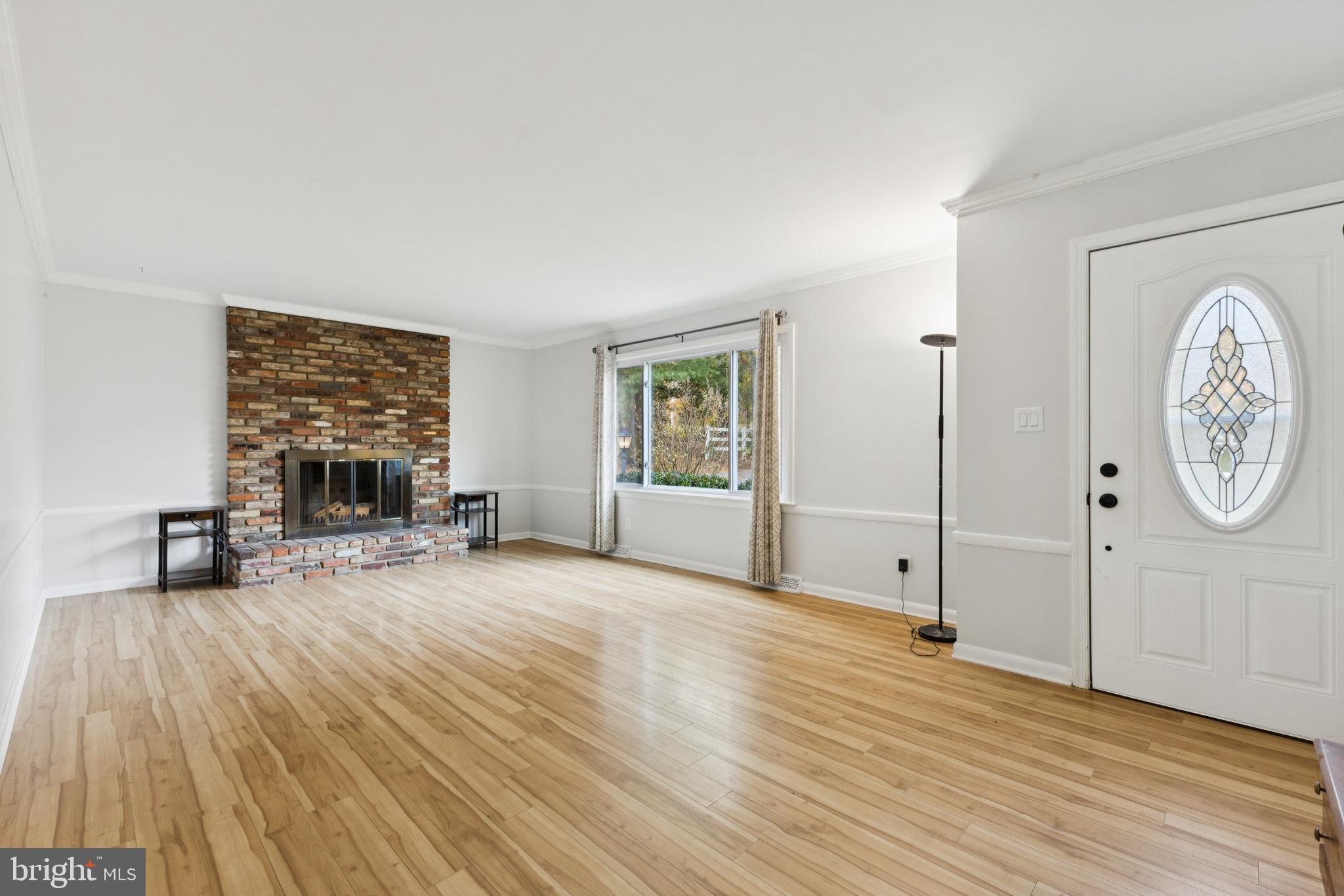 24530 Hollywood Road Hollywood, MD 20636 - Photo 5 of 40 a view of a livingroom with wooden floor and a large window