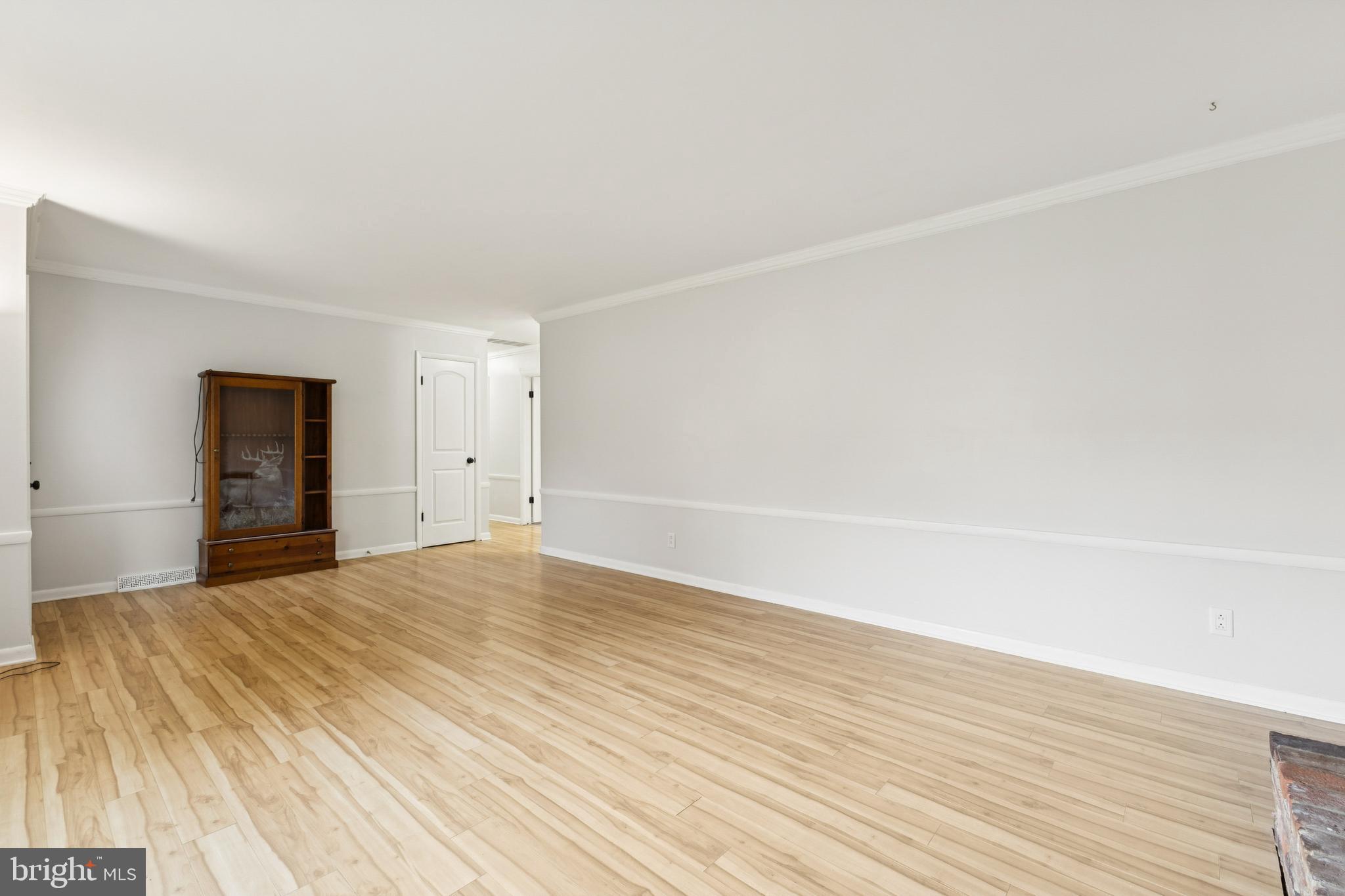 24530 Hollywood Road Hollywood, MD 20636 - Photo 7 of 40 a view of empty room with wooden floor and fan