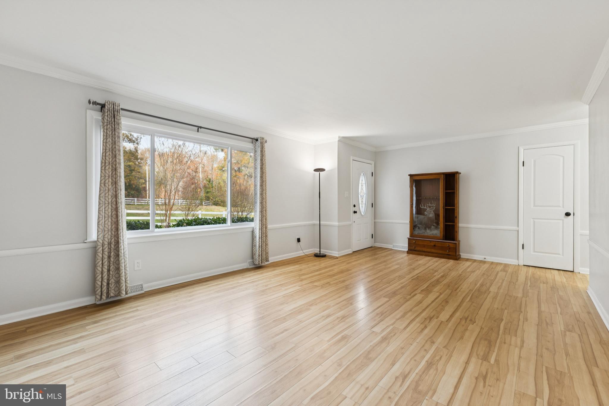24530 Hollywood Road Hollywood, MD 20636 - Photo 8 of 40 a view of an empty room with wooden floor and a window