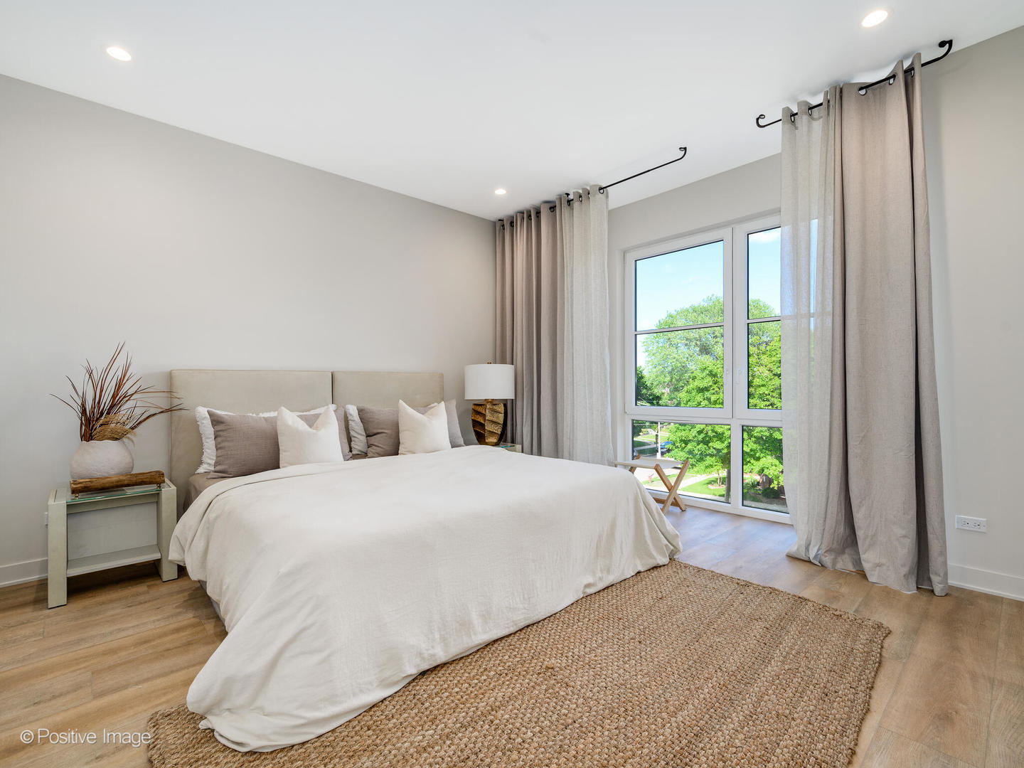 8038 Pine Court River Grove, IL 60171 - Photo 11 of 25 a bedroom with a large bed and a window