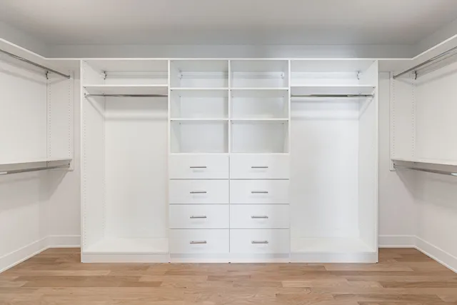 a spacious bathroom with a double vanity sink mirror and double