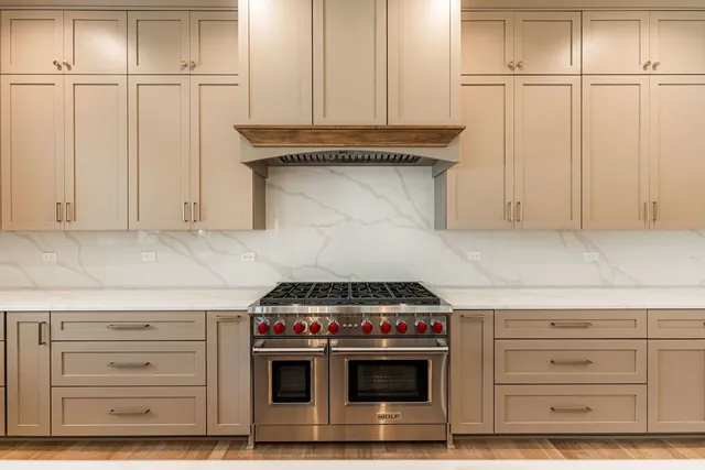 a kitchen with stainless steel appliances a sink and cabinets
