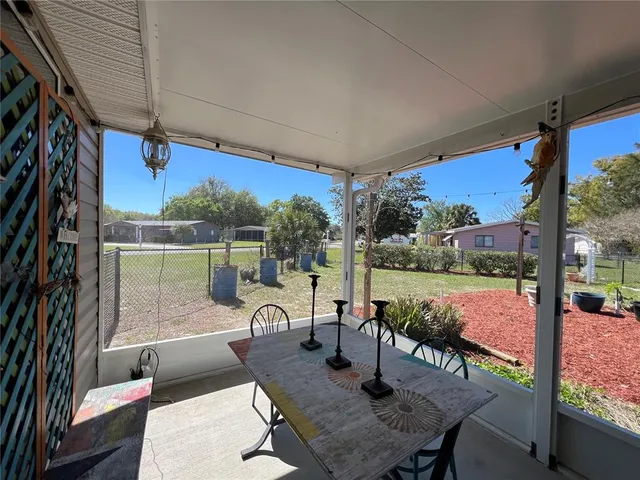a view of a livingroom with workspace and a couch