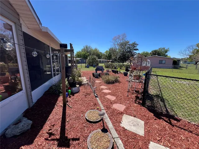 a view of a livingroom with furniture wooden floor and front door