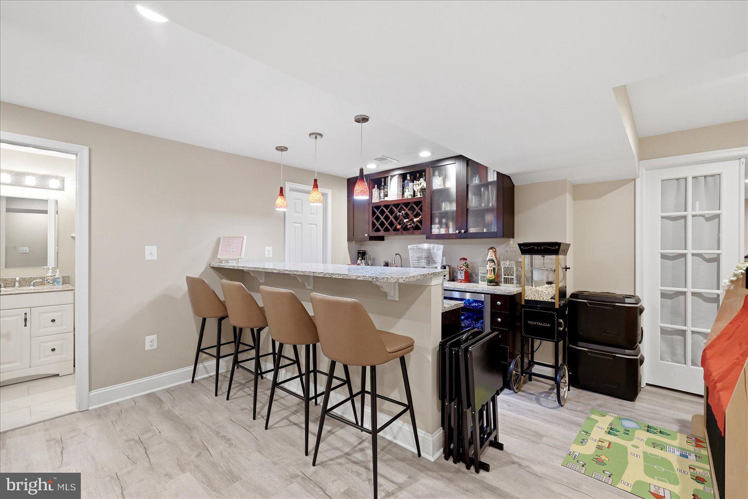 911 Riva Ridge Drive Great Falls, VA 22066 - Photo 26 of 55 Modern kitchen with stylish bar seating.