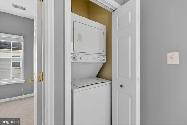 a view of bathroom with a washer and dryer
