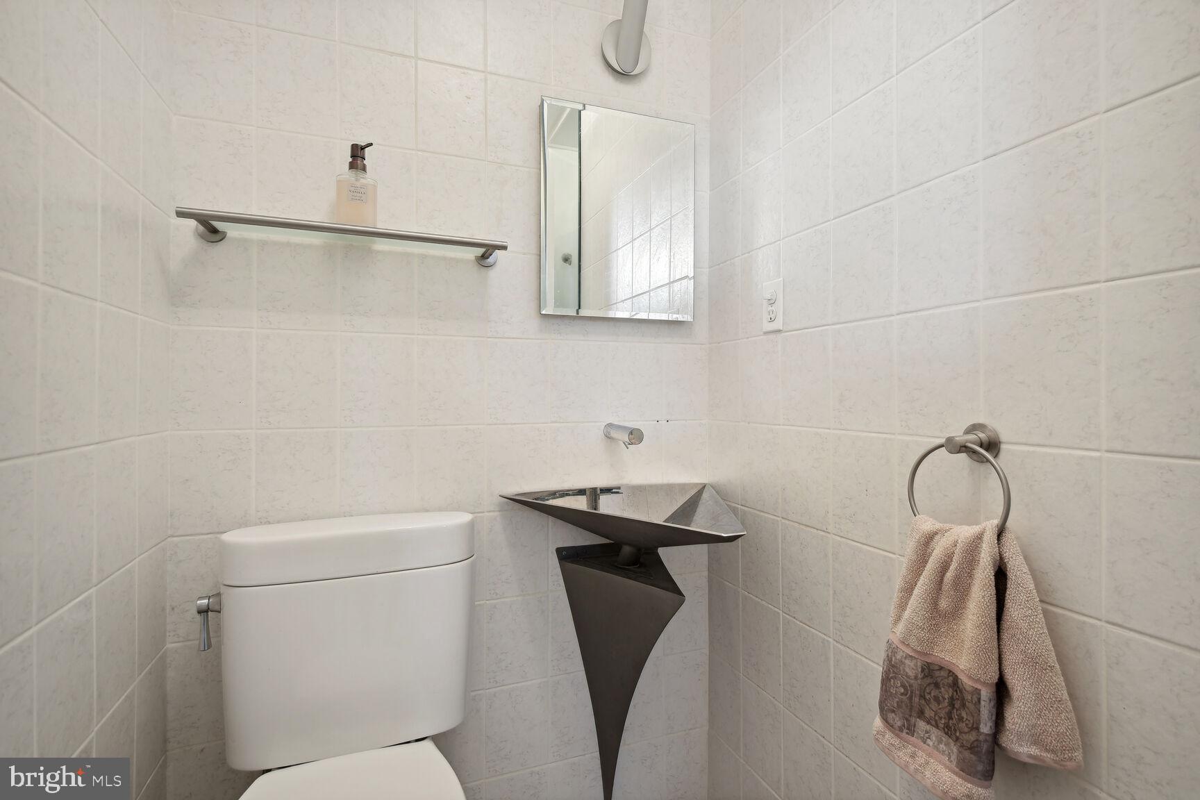 6765 Brigadoon Drive Bethesda, MD 20817 - Photo 13 of 30 Main floor half bath