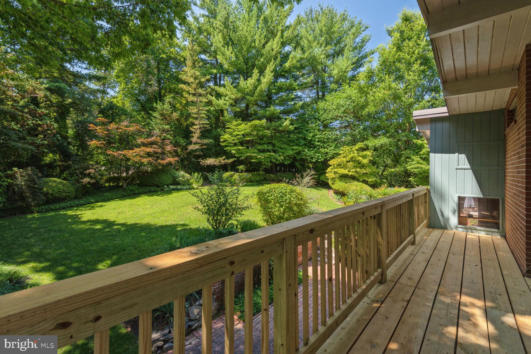 6765 Brigadoon Drive Bethesda, MD 20817 - Photo 15 of 30 Primary suite balcony overlooking landscaped yard