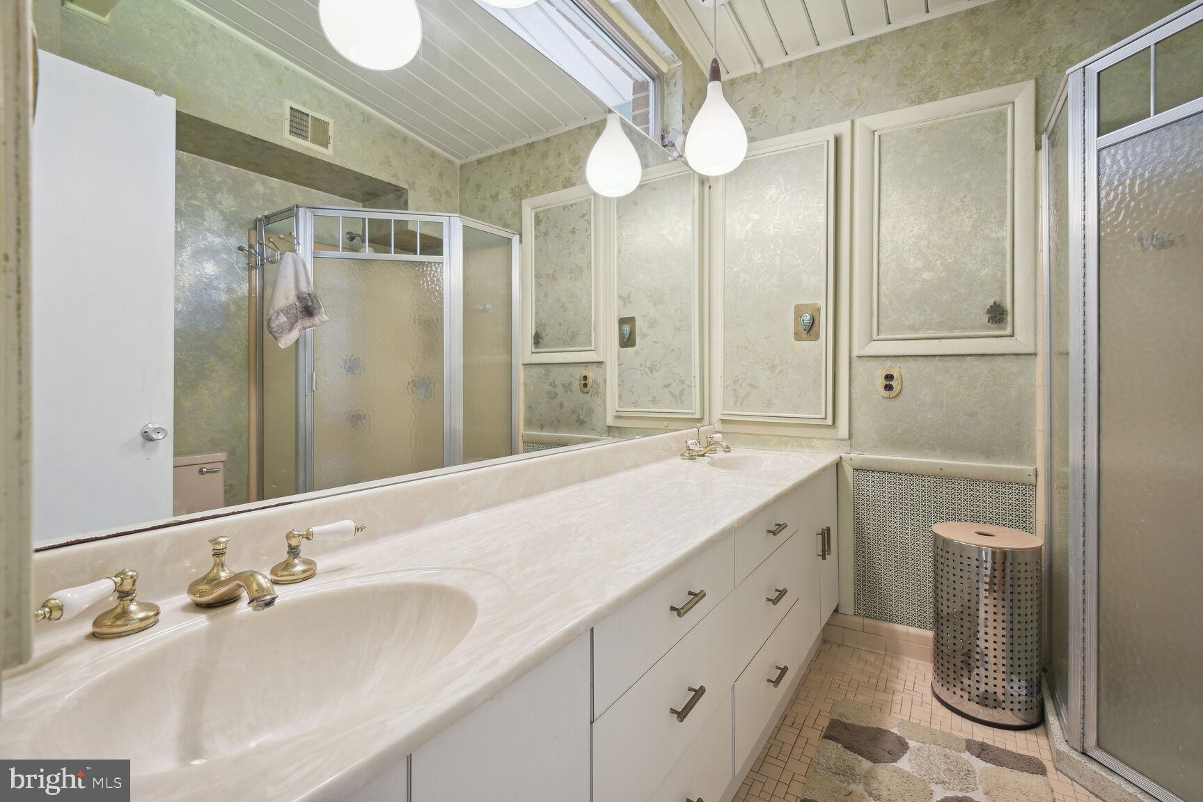 6765 Brigadoon Drive Bethesda, MD 20817 - Photo 16 of 30 Primary ensuite bath with dual sink vanity