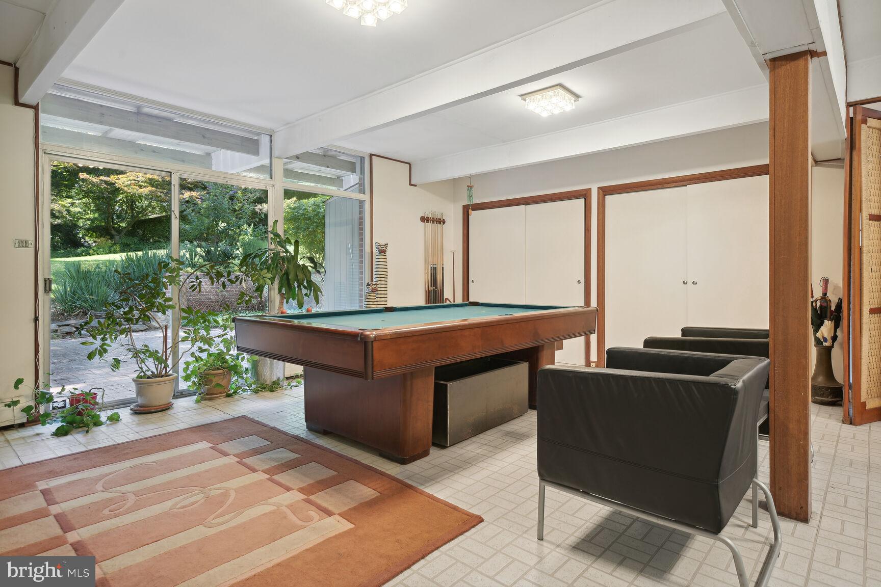 6765 Brigadoon Drive Bethesda, MD 20817 - Photo 21 of 30 Rec/party room walks out to patio and backyard