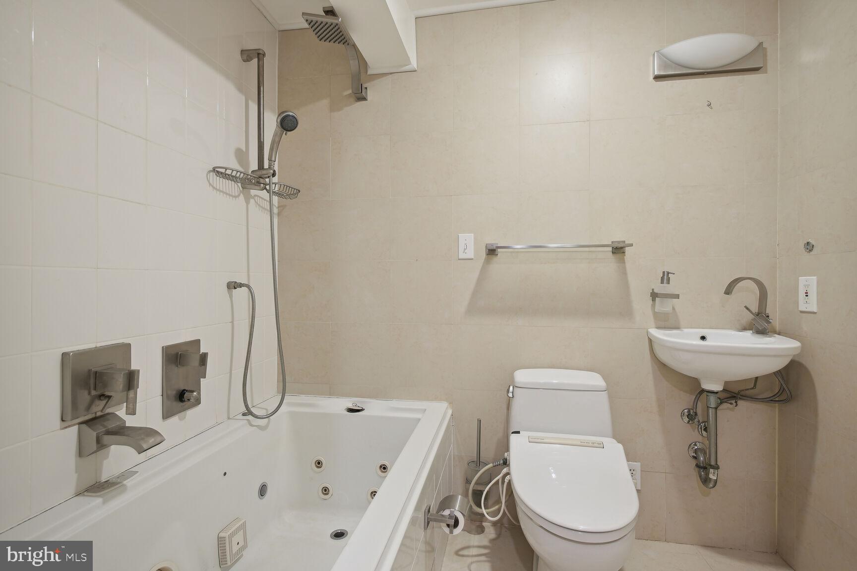 6765 Brigadoon Drive Bethesda, MD 20817 - Photo 27 of 30 Lower level full bath with jacuzzi tub