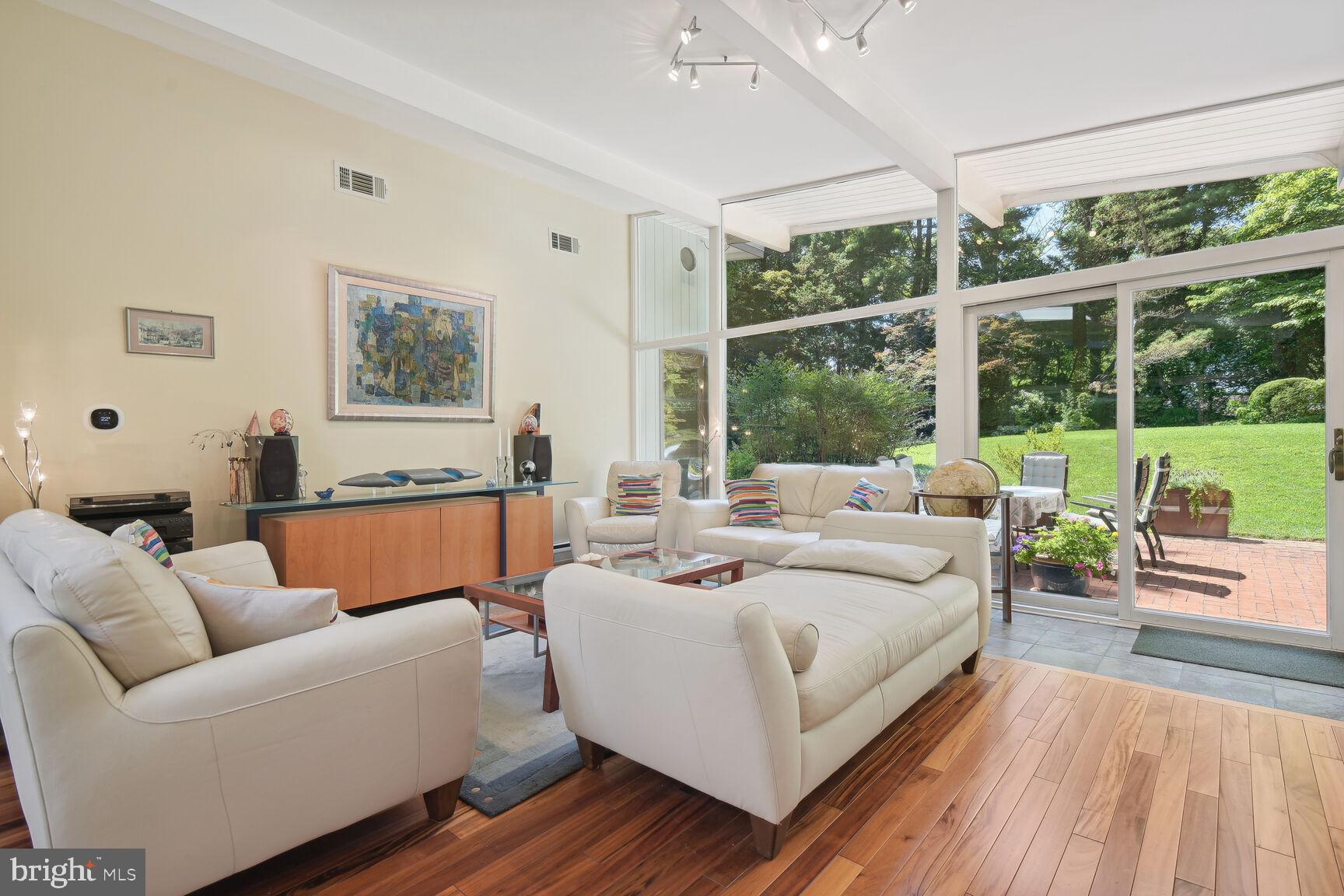 6765 Brigadoon Drive Bethesda, MD 20817 - Photo 3 of 30 Expansive living room that opens to brick patio