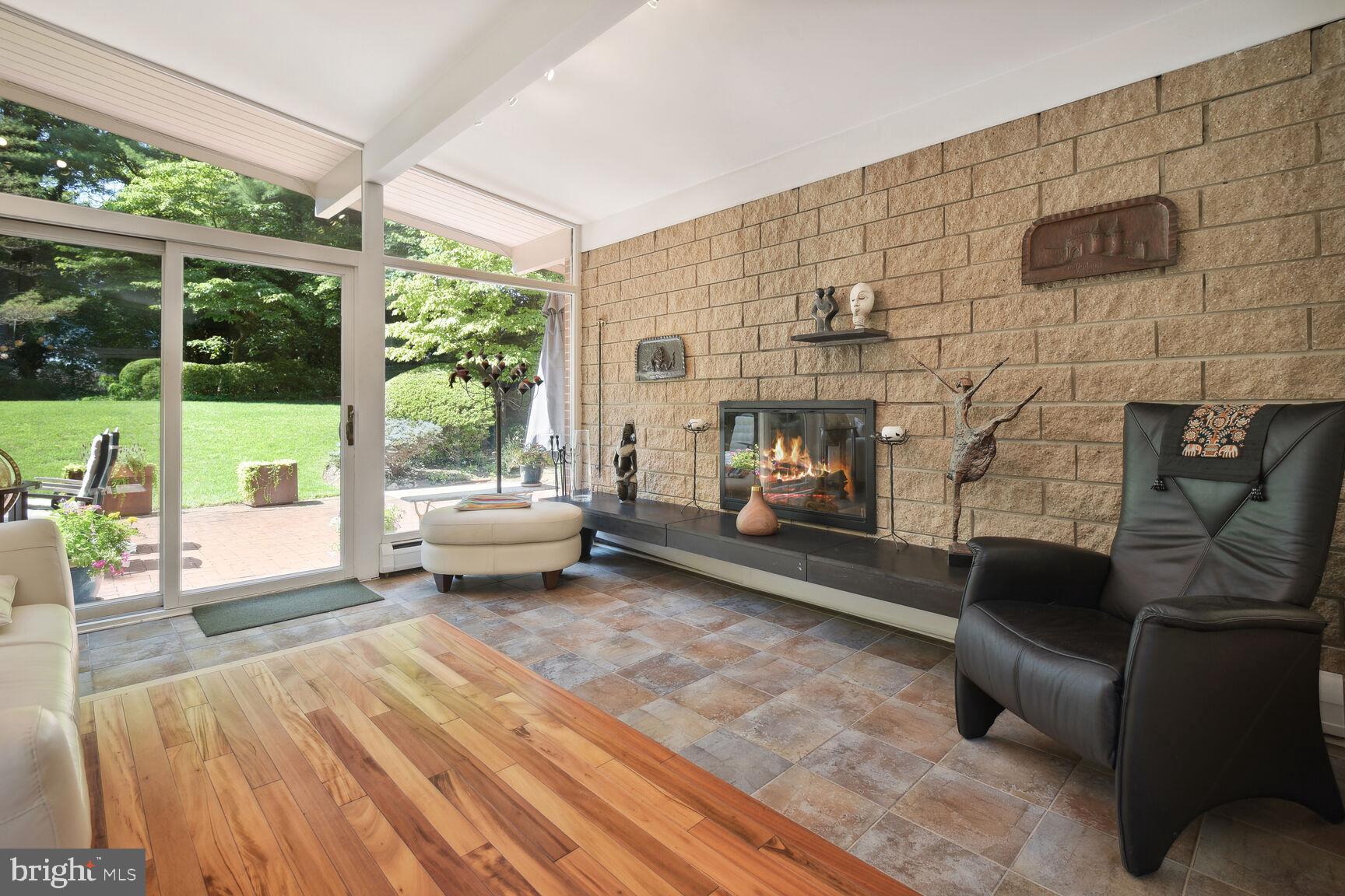 6765 Brigadoon Drive Bethesda, MD 20817 - Photo 4 of 30 Living room features fireplace