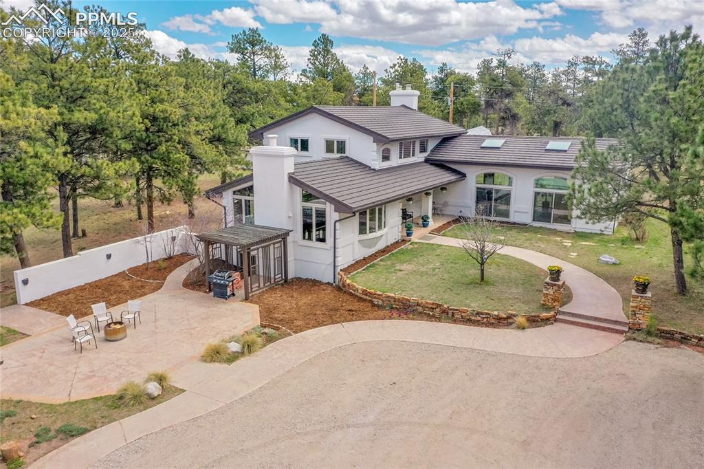 17350 Goshawk Road Colorado Springs, CO 80908 - Photo 1 of 50 front view of a house with a swimming pool