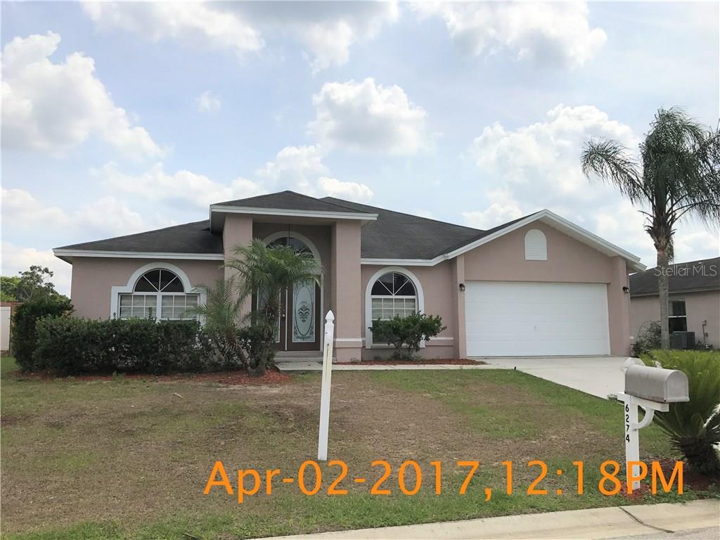 6274 Hampton Pointe Circle Lakeland, FL 33813 - Photo 1 of 1 a front view of a house with garden