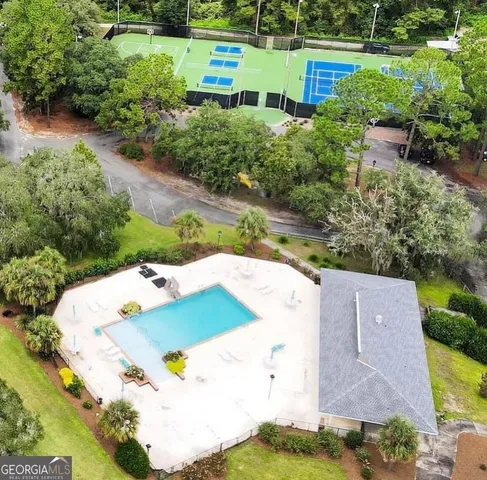 an aerial view of a house with outdoor space and lake view