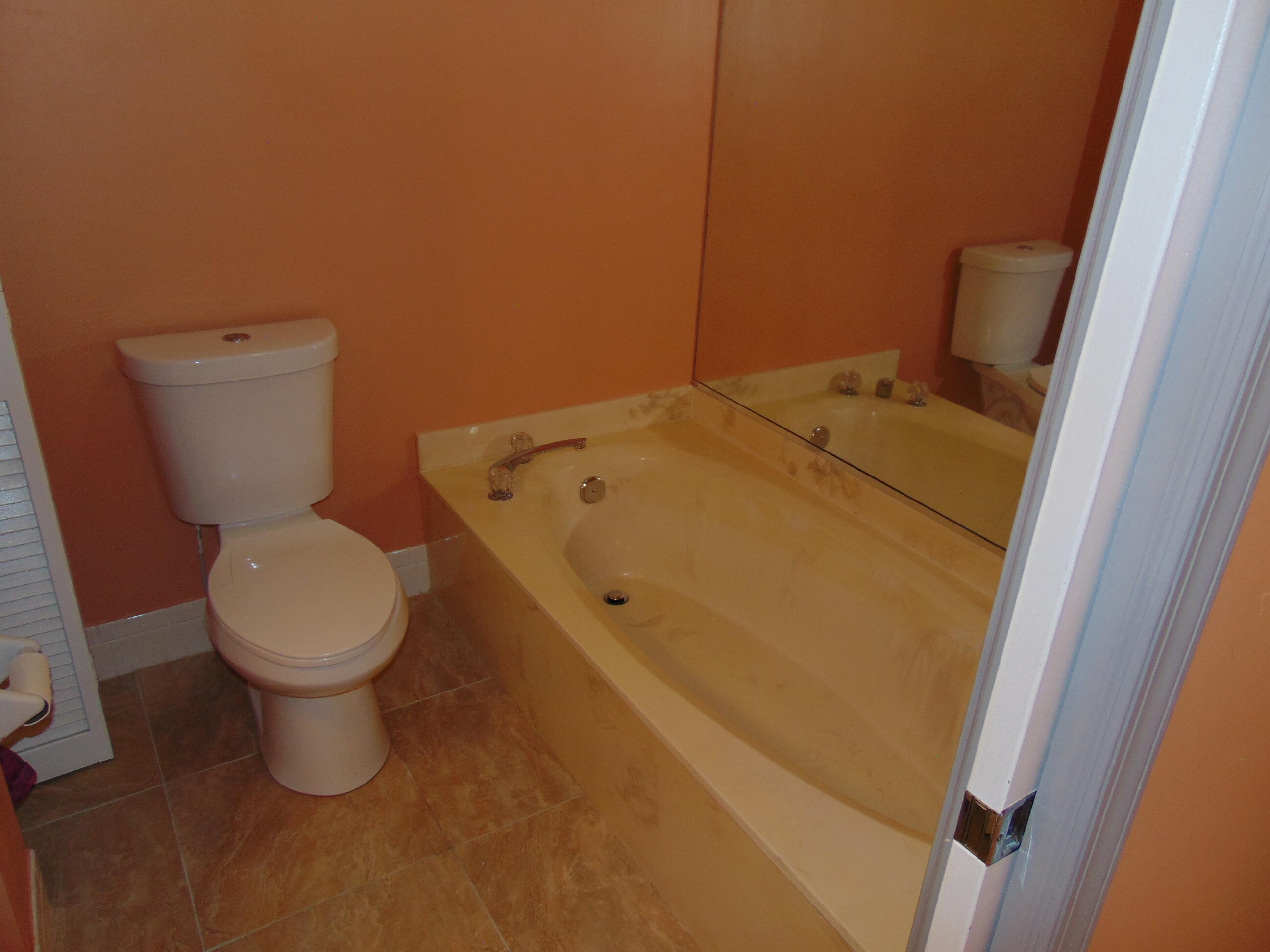 9220 Southwest 14th Street, Unit 3103 Boca Raton, FL 33428 - Photo 21 of 58 a bathroom with a toilet and a sink