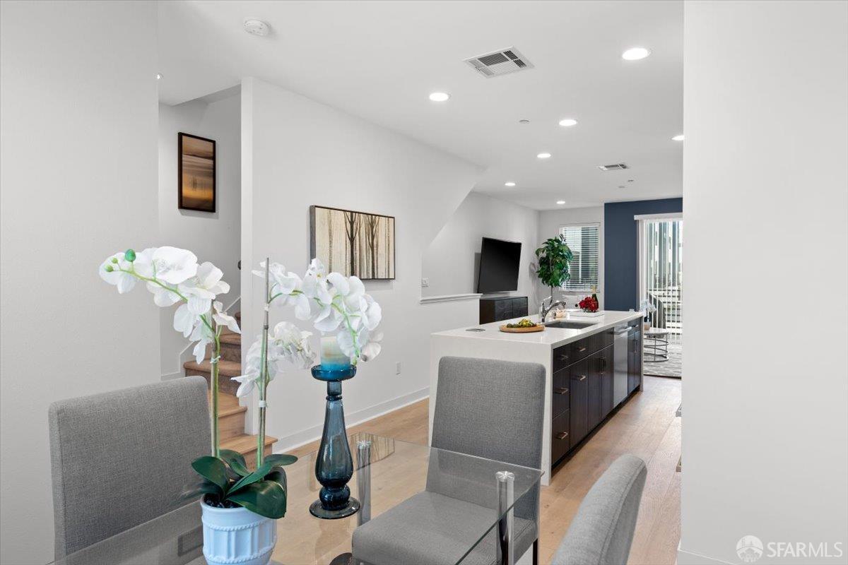 1807 16th Street Oakland, CA 94607 - Photo 11 of 45 a living room with furniture potted plant and a chandelier