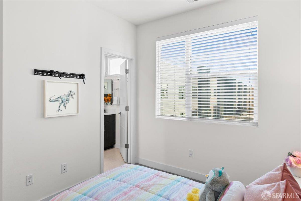 1807 16th Street Oakland, CA 94607 - Photo 16 of 45 a bedroom with a bed and a window