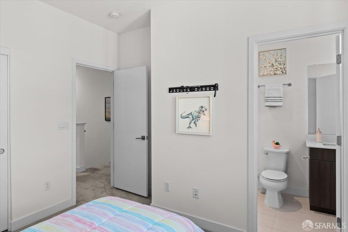 1807 16th Street Oakland, CA 94607 - Photo 17 of 45 a bathroom with a toilet and a shower