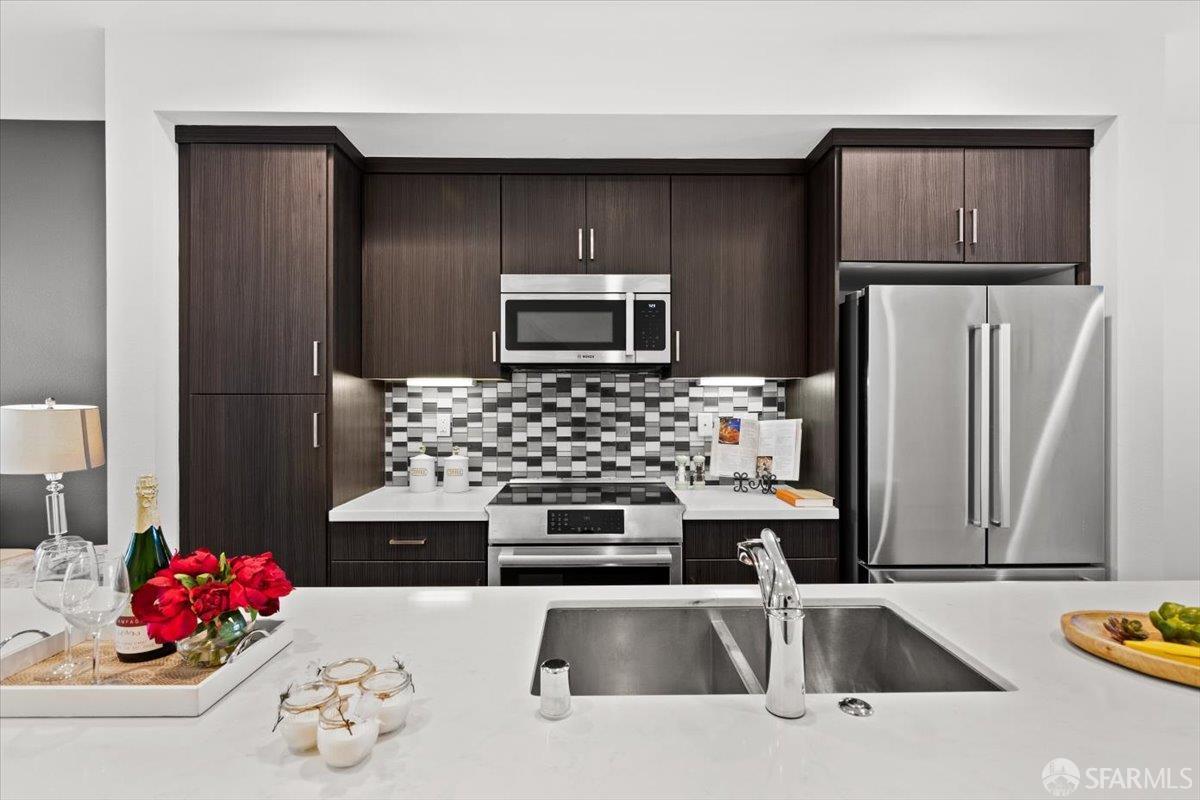 1807 16th Street Oakland, CA 94607 - Photo 2 of 45 a kitchen with a sink and a refrigerator