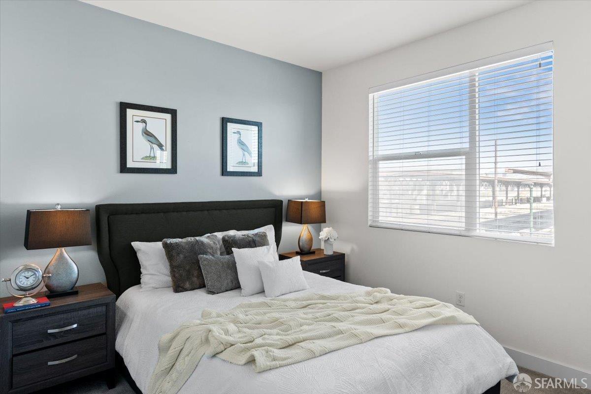 1807 16th Street Oakland, CA 94607 - Photo 24 of 45 a bedroom with bed and window