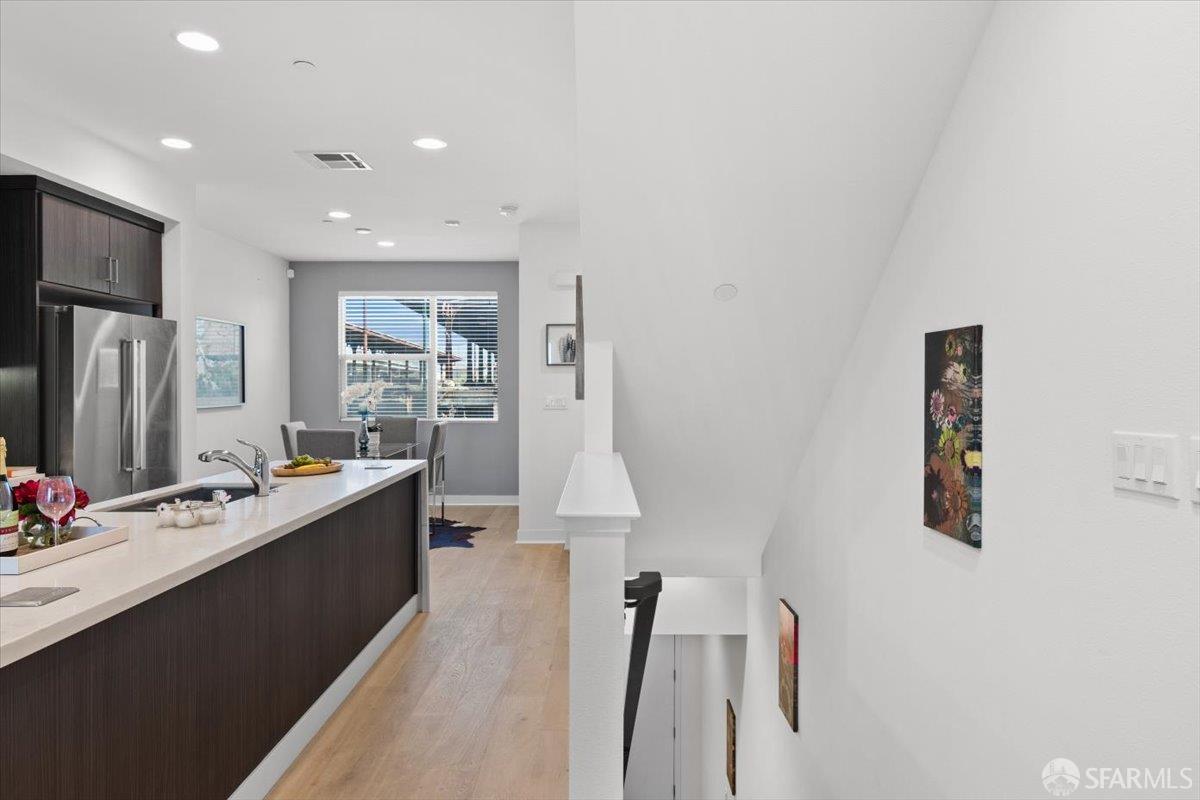 1807 16th Street Oakland, CA 94607 - Photo 3 of 45 a large white kitchen with a lot of counter space and refrigerator