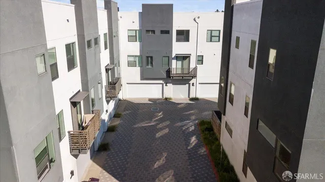 a view of a street with a building in the background