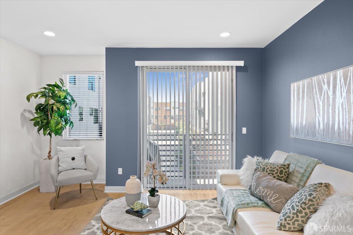 1807 16th Street Oakland, CA 94607 - Photo 4 of 45 a living room with furniture and a potted plant