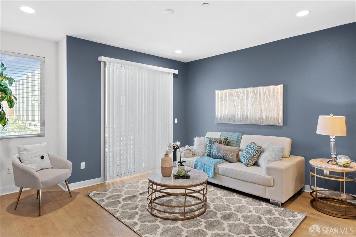 1807 16th Street Oakland, CA 94607 - Photo 5 of 45 a living room with furniture and a large window